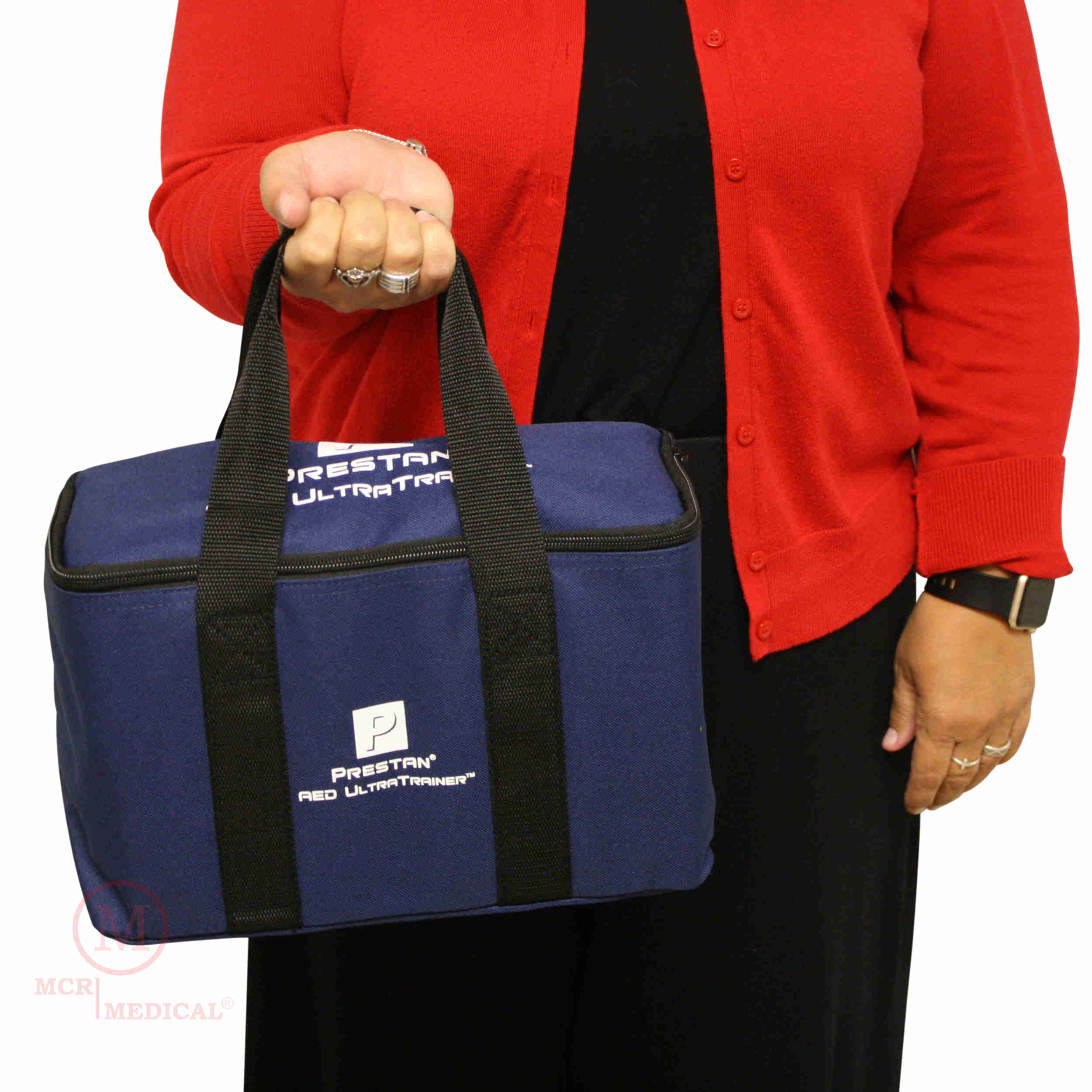 PRESTAN AED trainer- UltraTrainer- person holding 4 pack bag